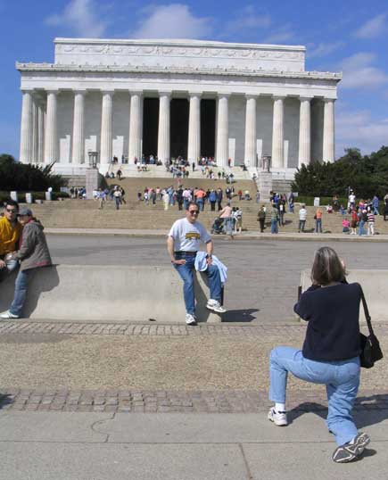 Tourists taking photos in front of lincoln memorial